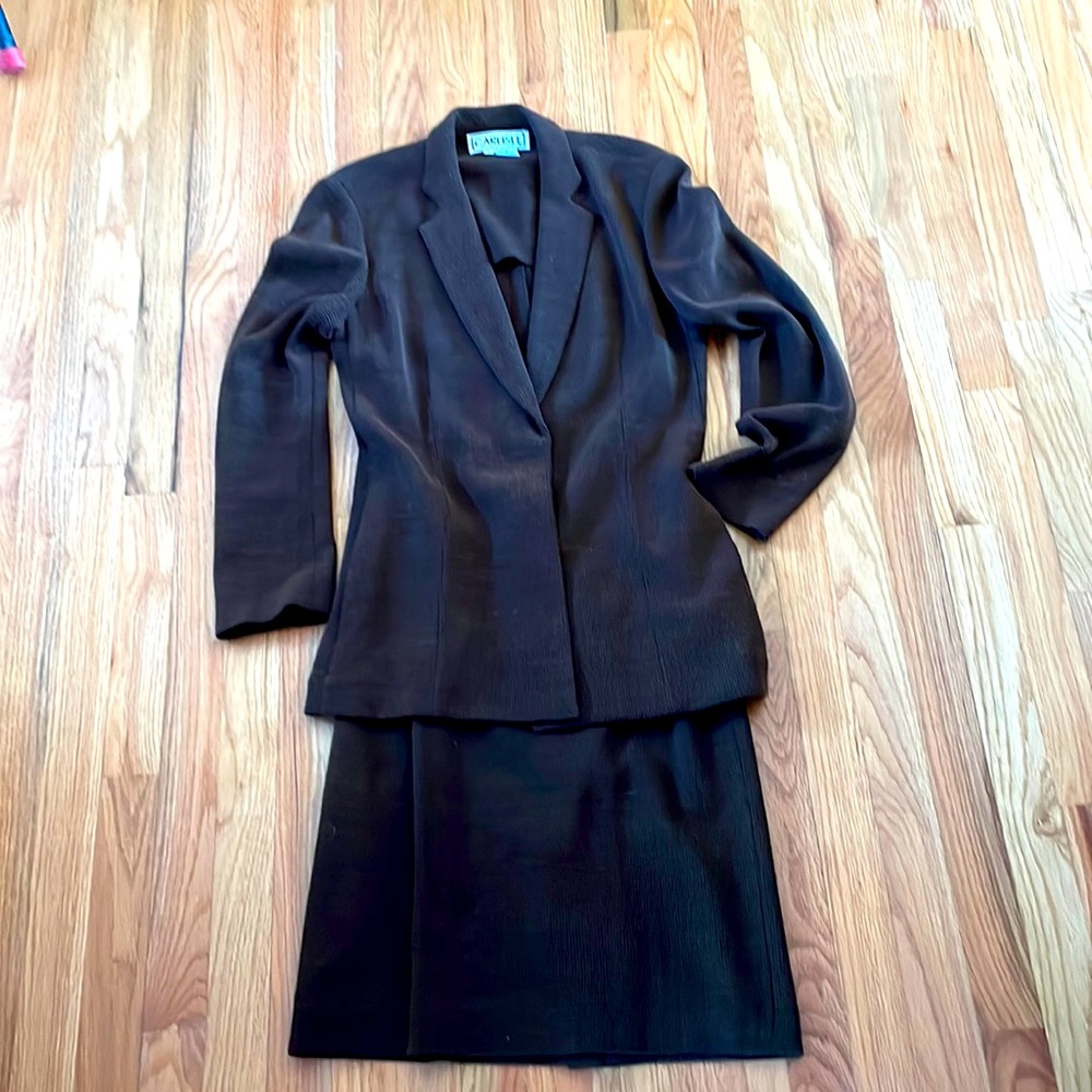 Designer suit with blazer, pants, and skirt.